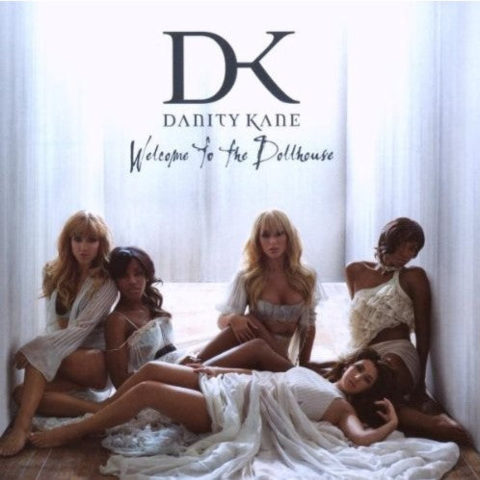 Promotional image for Danity Kane's 'Welcome To The Dollhouse' featuring models in a bedroom setting.